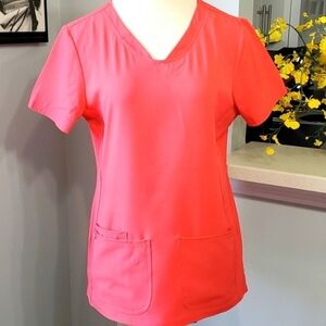 Scrubs top by heart and soul. Size medium.  Style 20710 color RBGR( peach/pink)